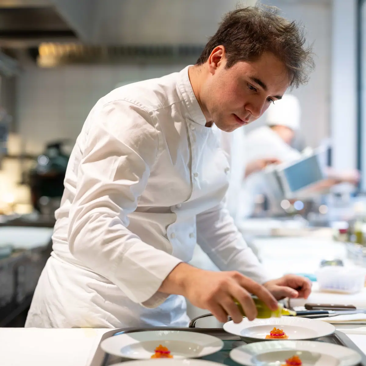 In the kitchen, at the pass
